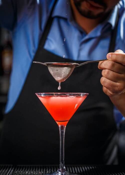 barman-makes-cosmopolitan-cocktail.jpg